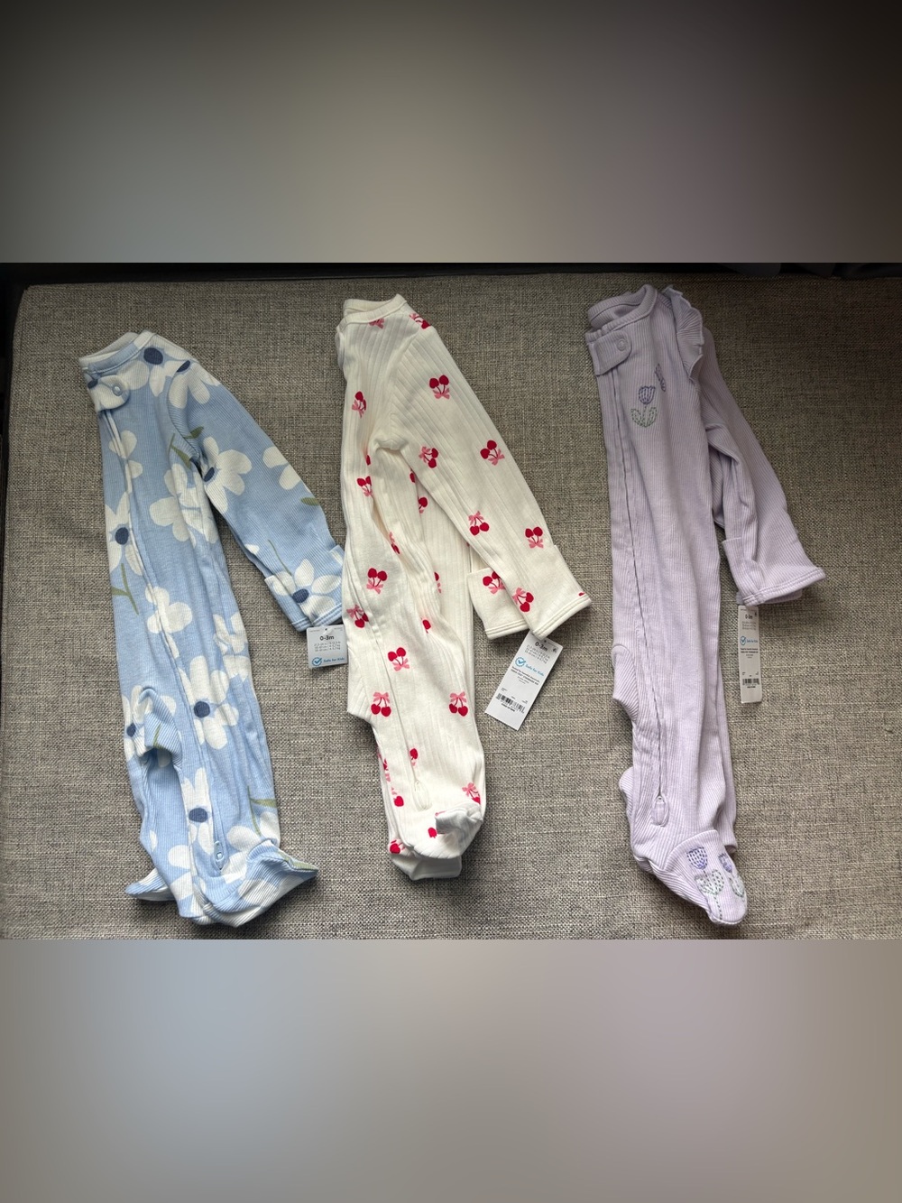 3 Carter’s Footed Onesies